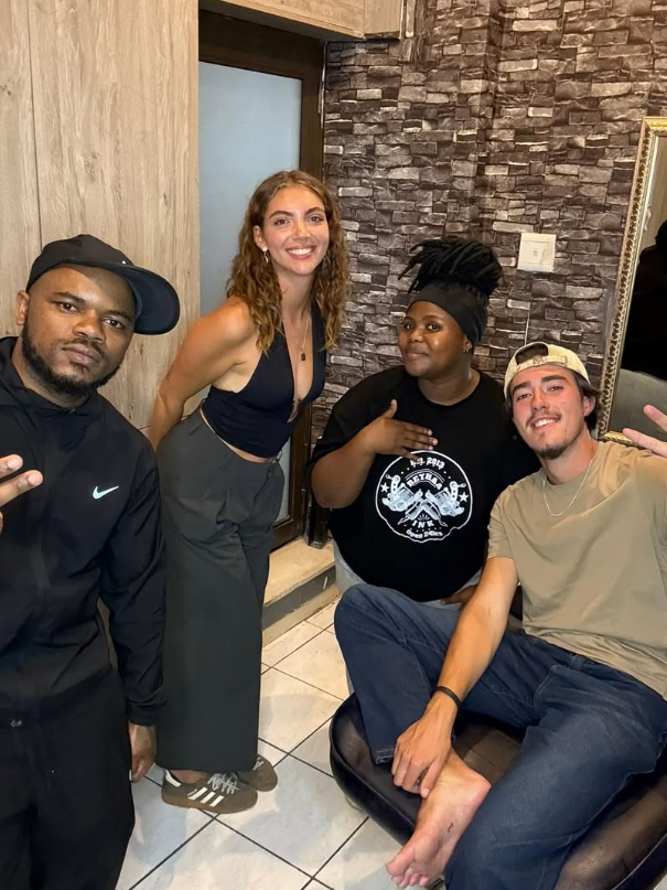 Bloodwell hanging out with clients at the parlour